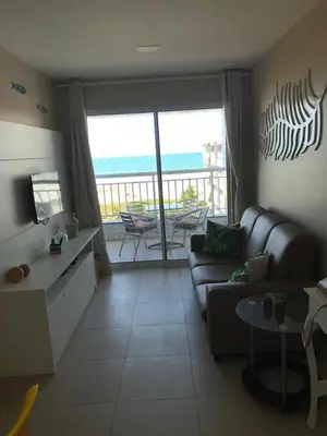 Uma área de estar em Apartamento no Porto das Dunas - Beach Way