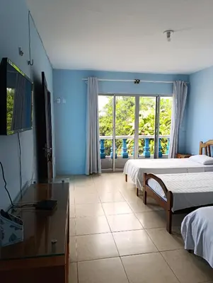 Uma televisão e/ou sistema de entretenimento em Pousada Azul da Broadway