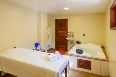 Uma cama ou camas num quarto em Hotel Villa Beija Flor