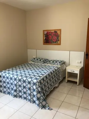 Uma cama ou camas num quarto em Apto próximo ao Shopping Iguatemi e Centro de Eventos
