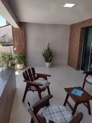 Uma área de estar em Pousada Centro e Praia