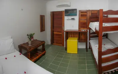 Uma cama ou camas num quarto em Pousada Jerimar
