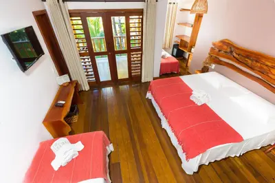 Uma cama ou camas num quarto em Vila Coqueiros Boutique Hotel