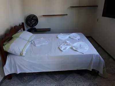 Uma cama ou camas num quarto em Pousada Aconchego