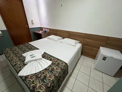 Uma cama ou camas num quarto em Abrolhos Praia Hotel