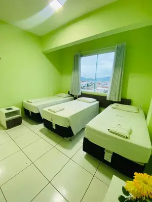 Uma cama ou camas num quarto em Hotel Letiva Arco