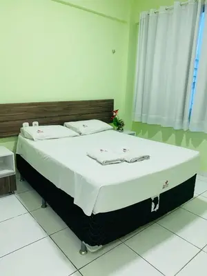 Uma cama ou camas num quarto em Hotel Letiva Arco