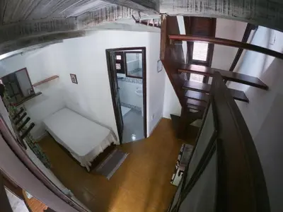 Uma cama ou camas num quarto em Pousada Ibirapuera