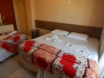 Uma cama ou camas num quarto em Algarve Praia Hotel