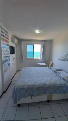 Uma cama ou camas num quarto em STUDIO EM FORTALEZA NO CONDOMINIO VILA DE IRACEMA
