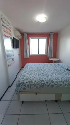 Uma cama ou camas num quarto em STUDIO EM FORTALEZA NO CONDOMINIO VILA DE IRACEMA