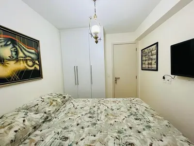 Uma cama ou camas num quarto em Cond. Beach Village Residence 1