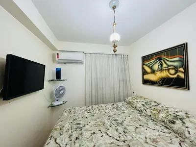 Uma cama ou camas num quarto em Cond. Beach Village Residence 1