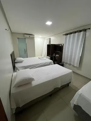 Uma cama ou camas num quarto em Seller Hotel