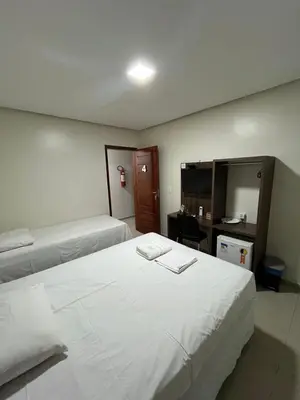 Uma cama ou camas num quarto em Seller Hotel
