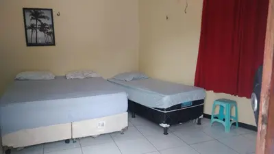 Uma cama ou camas num quarto em casa na praia de guajiru