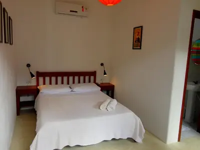 Uma cama ou camas num quarto em Pousada Atlantis