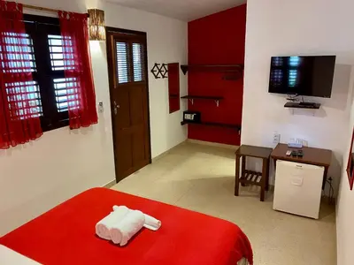 Uma cama ou camas num quarto em Pousada Atlantis