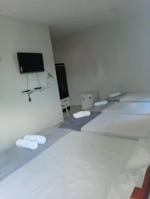 Uma cama ou camas num quarto em Pousada Atlantico Centro - Fortaleza