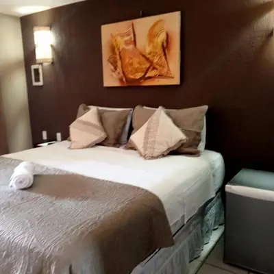 Uma cama ou camas num quarto em Hotel Pousada Cumbuco Gold