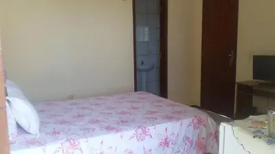 Uma cama ou camas num quarto em Pousada Recanto das Férias