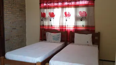Uma cama ou camas num quarto em Pousada Recanto das Férias