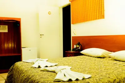 Uma cama ou camas num quarto em Hotel Poyares