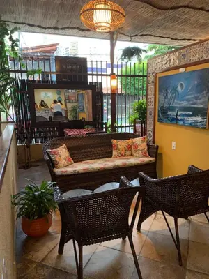 Uma televisão e/ou sistema de entretenimento em Maré Praia Hotel