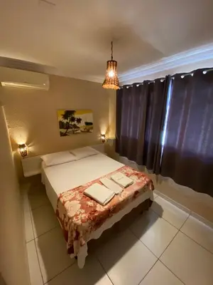 Uma cama ou camas num quarto em Maré Praia Hotel