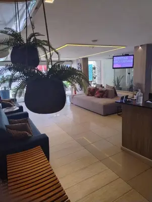Uma área de estar em Villa Park Hotel Fortaleza