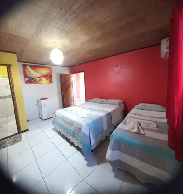 Uma cama ou camas num quarto em Pousada Sena