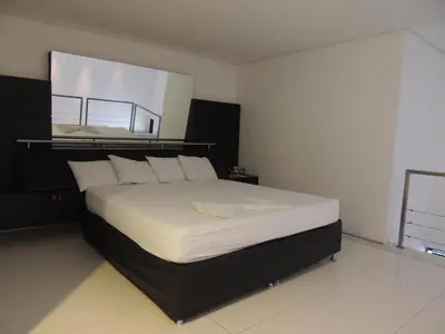Uma cama ou camas num quarto em Palace Fortaleza Centro de Eventos motel