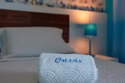 Uma cama ou camas num quarto em Jardim dos Orixás