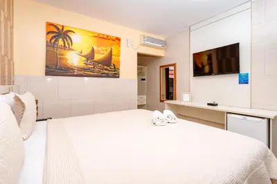 Uma cama ou camas num quarto em Jardim dos Orixás
