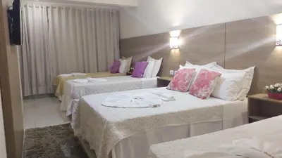 Uma cama ou camas num quarto em Planet Dunas Residence