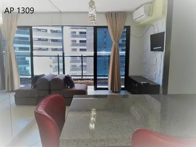 Uma televisão e/ou sistema de entretenimento em Apartamentos Landscape Beira Mar