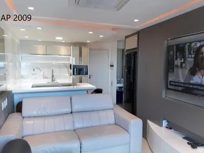 Uma televisão e/ou sistema de entretenimento em Apartamentos Landscape Beira Mar
