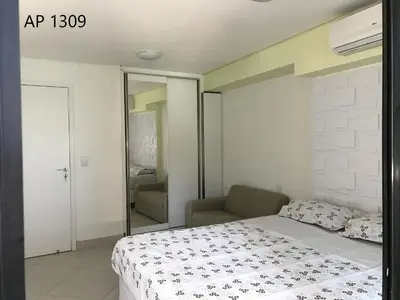 Uma cama ou camas num quarto em Apartamentos Landscape Beira Mar