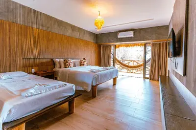 Uma cama ou camas num quarto em Hotel Casa do Mar