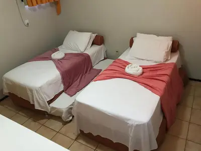 Uma cama ou camas num quarto em Aquaville, pé-na-areia, lazer, 900m do Beach Park