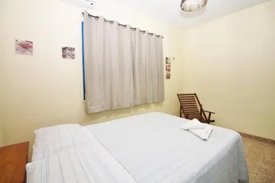 Uma cama ou camas num quarto em Pousada Fortaleza Aeroporto House