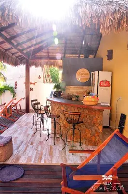 Uma área de estar em Villa Água de Coco