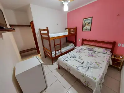 Uma cama ou camas num quarto em Pousada Chalet La Pink