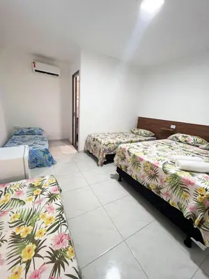 Uma cama ou camas num quarto em Pousada Chalet La Pink