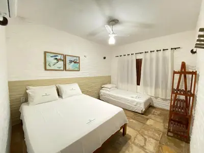 Uma cama ou camas num quarto em Condado da Praia ,casa em Flecheiras 7 a 10 suítes