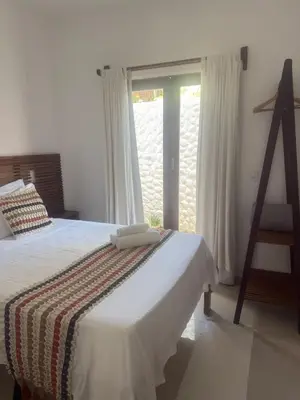 Uma cama ou camas num quarto em Apê Charm Jeri