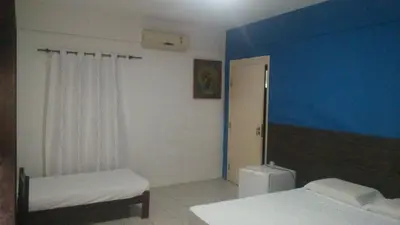 Uma cama ou camas num quarto em Hotel Belas Artes