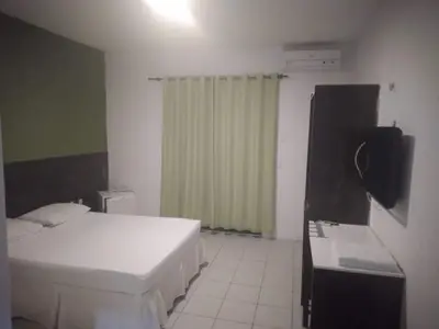 Uma cama ou camas num quarto em Hotel Belas Artes
