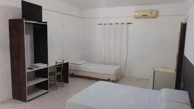 Uma cama ou camas num quarto em Hotel Belas Artes