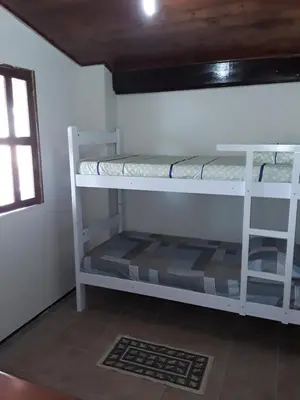 Uma ou mais camas em beliche num quarto em Villa Orazio Prainha